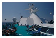 One deck up from the pool deck, looking aft.  The windows look down into the Windjammer.