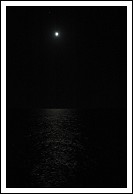 Hard to pick out... moon rise over the Atlantic Ocean, reflecting on the water.