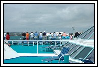 Passengers watch as we approach the dock.