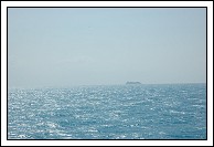 Grandeur of the Seas, off in the distance.  She has just departed from the Dockyard, and I do not know why she is not using the same channel we are to leave Bermuda.