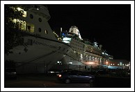 Azamara Journey, Empress of the Seas.  Notice the Viking crown Lounge lit up at the top of Empress.