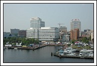 Scenes of downtown Norfolk, Virginia.  USS Wisconsin's bow just visible on the left side.