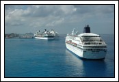 A view of several of the ships in port.  Norwegian Dream in the foreground, Constellation and a Princess ship docked, Freedom of the Seas and a Carnival ship off in the distance.