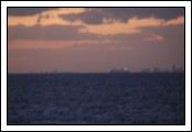 Very blurry, very far away, Freedom of the Seas puts out from Miami.