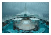 Several shots taken from the Viking Crown Lounge.  You can clearly see the sea spray splashing and blowing over
the top of the ship from the bow crashing into the waves.  This is Deck 10, over 100 feet above the water.