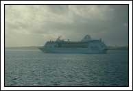 Empress of the Seas glides by unheard.