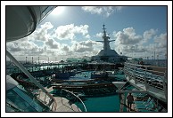 Pool deck and forward antenna mast heading into the setting sun.